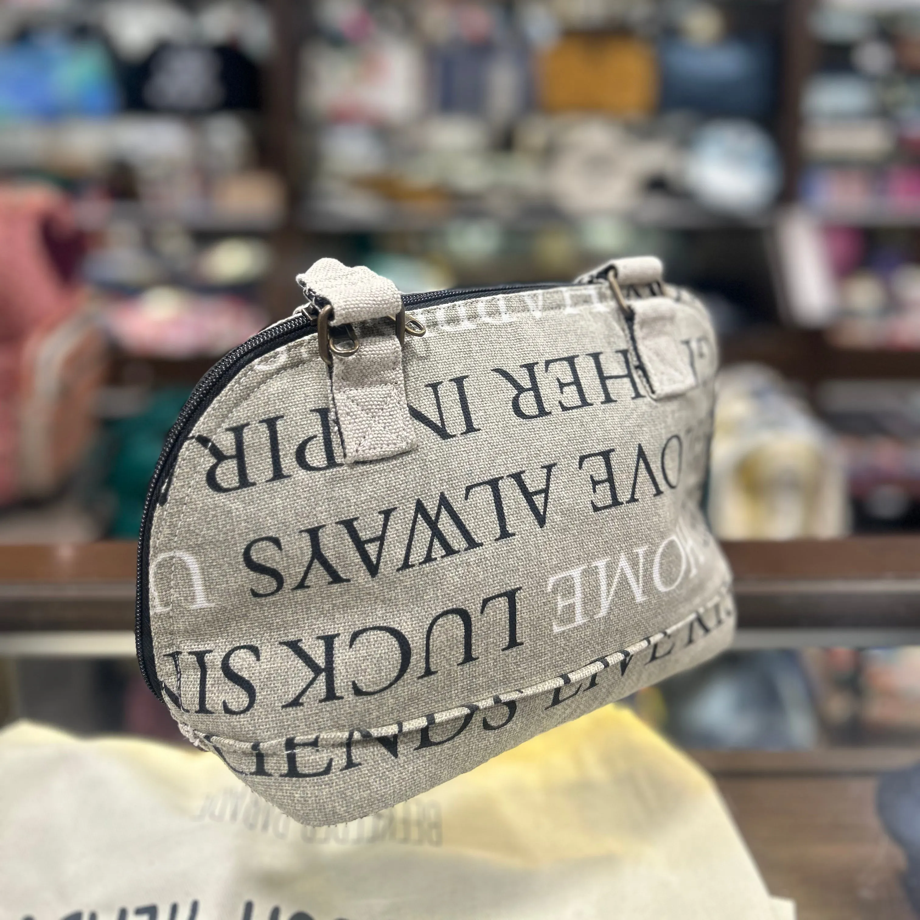 The Eco of words Clam Shell Handbag